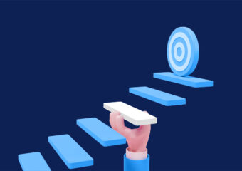 Digital graphic depicting a person's hand holding up a step on the pathway to the target.